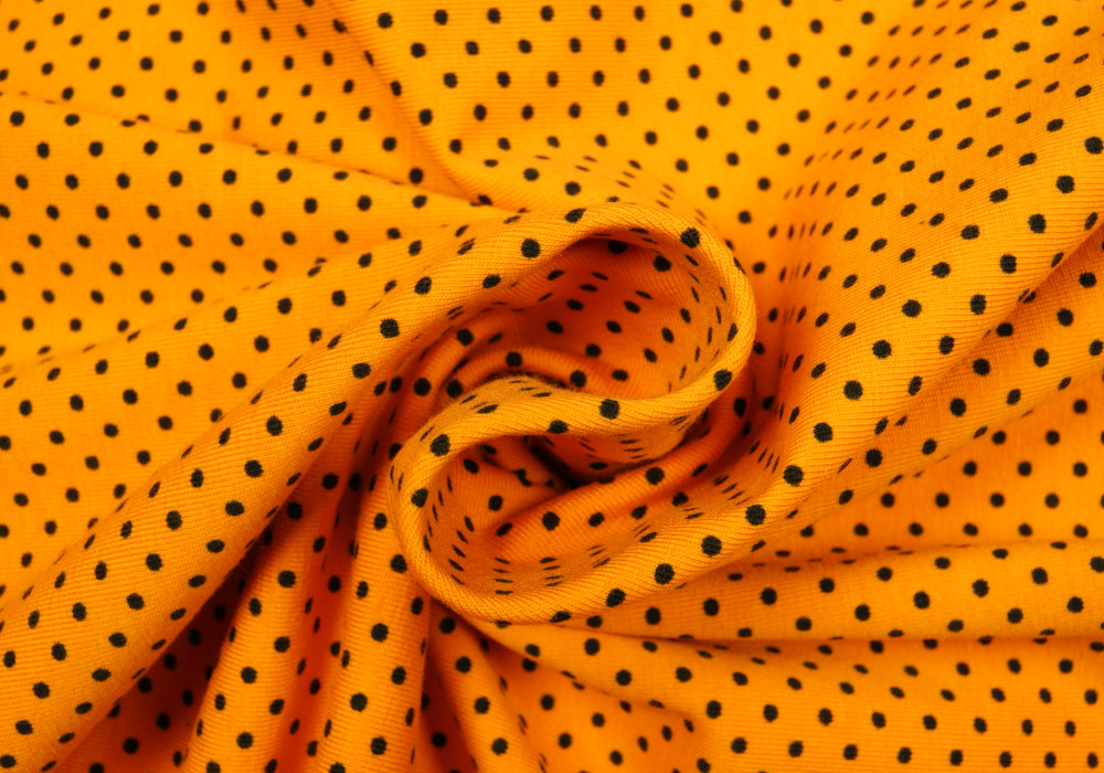 Stippen print tricot okergeel
