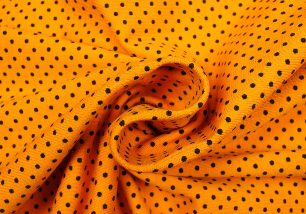 Stippen print tricot okergeel