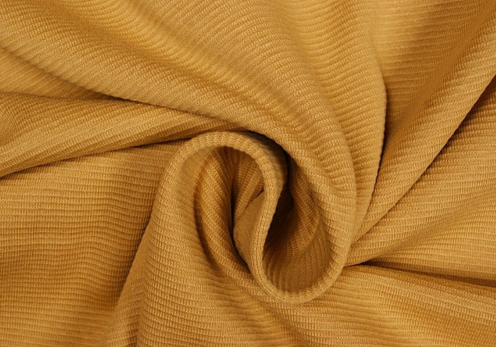 Boordstof tricot okergroen