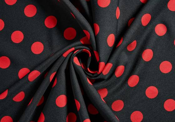 Zwarte stof met rode stippen